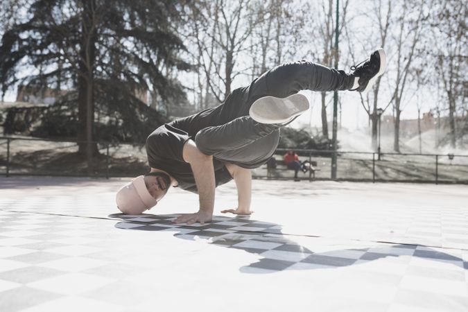 Man dancing break dance in park