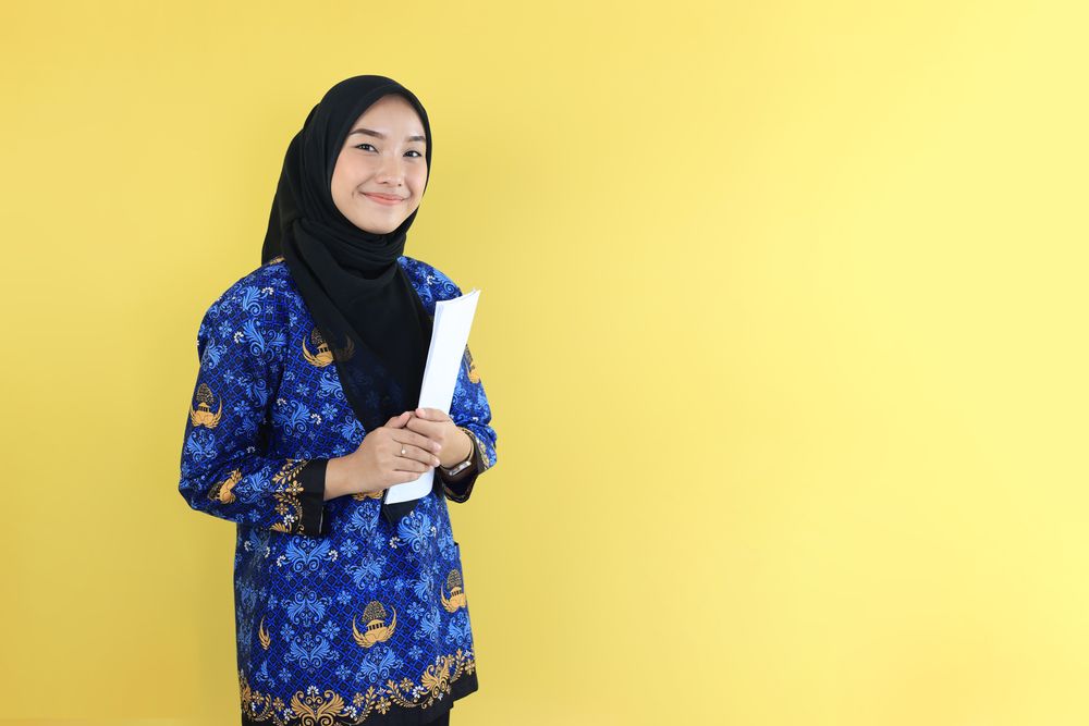 Young Female Asian Civil Servant Holding Paper Work Document