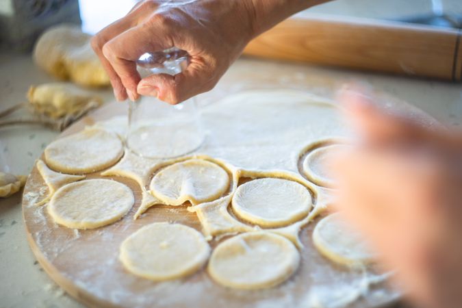 Traditional Ukrainian dumpling dough being cut