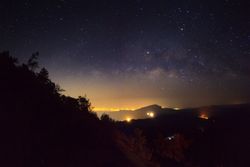 Milky way galaxy with stars and space dust in the universe, Long exposure photograph, with grain.