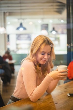 Woman having a cup of coffee