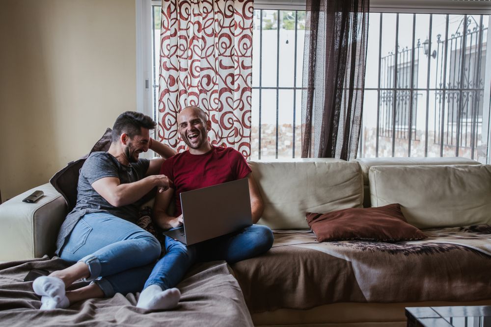 Gay couple with computer