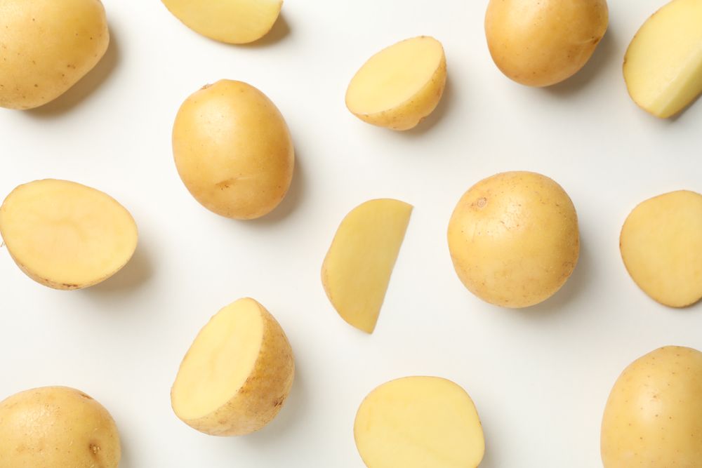 Looking down at scattered potato wedges