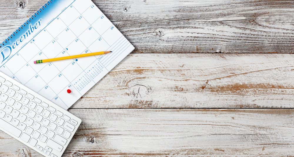 Desktop with calendar reminder of tax day
