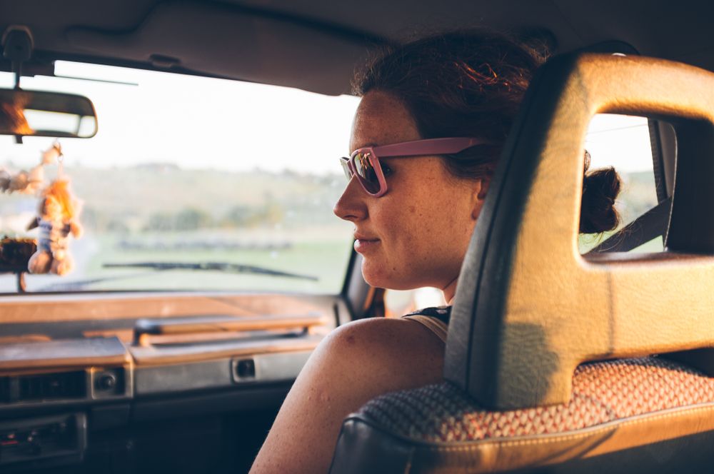Young woman traveling in car