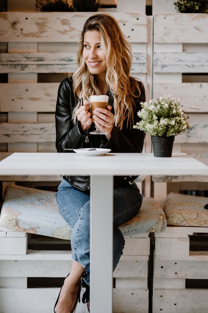 Woman drinking coffee from a glass