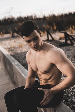 Strong male near concrete wall
