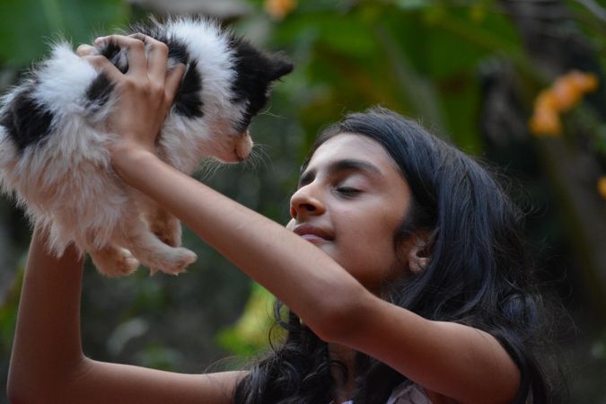Girl holding a puppy