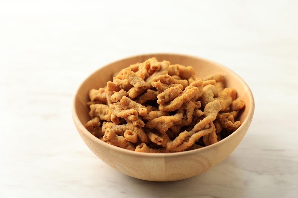 Crispy Fried Chicken Intestines in a Wooden Bowl
