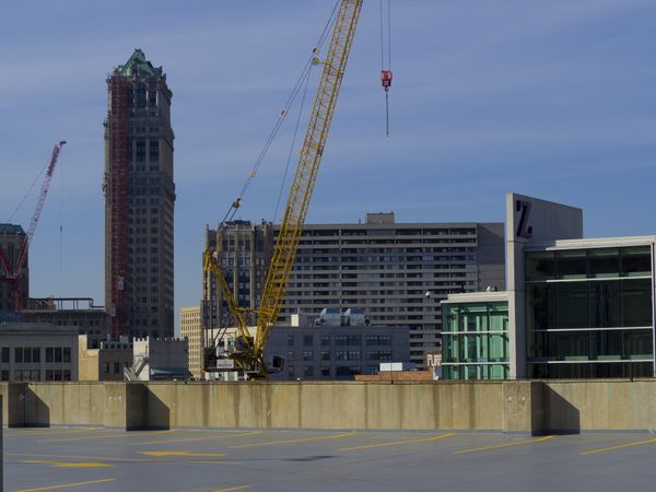 Yellow crane near buildings