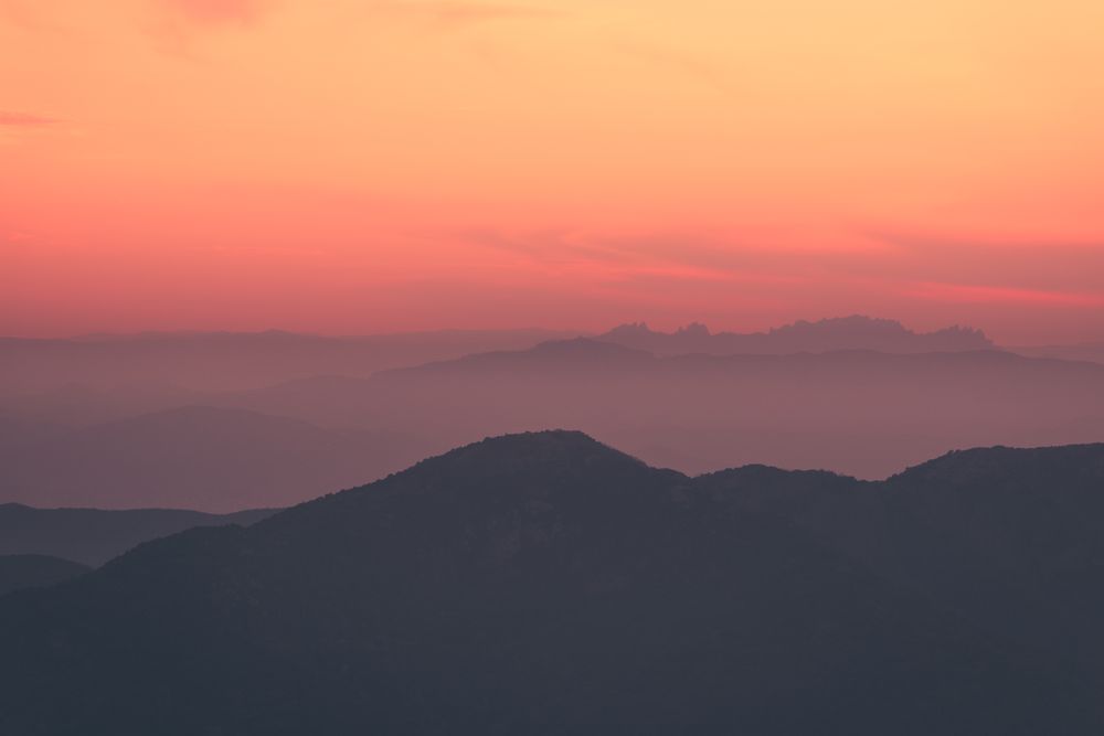 Sunset sky over mountain ridge