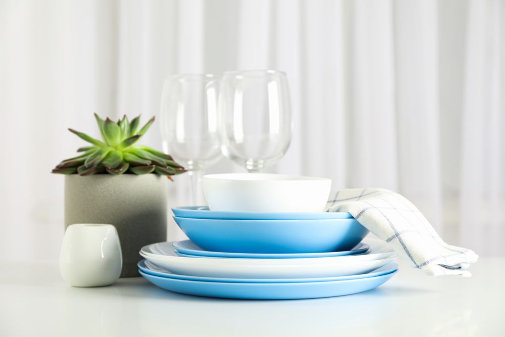 Cutlery with succulent plant stacked on table, space for text