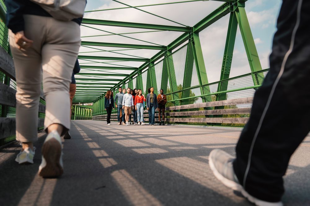 Multicultural group of friends on bridge