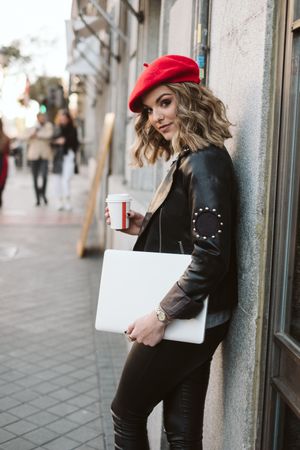 Woman with drink on the street