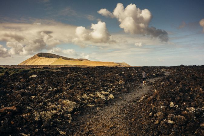 Woman walking towards hill in Lanzarote