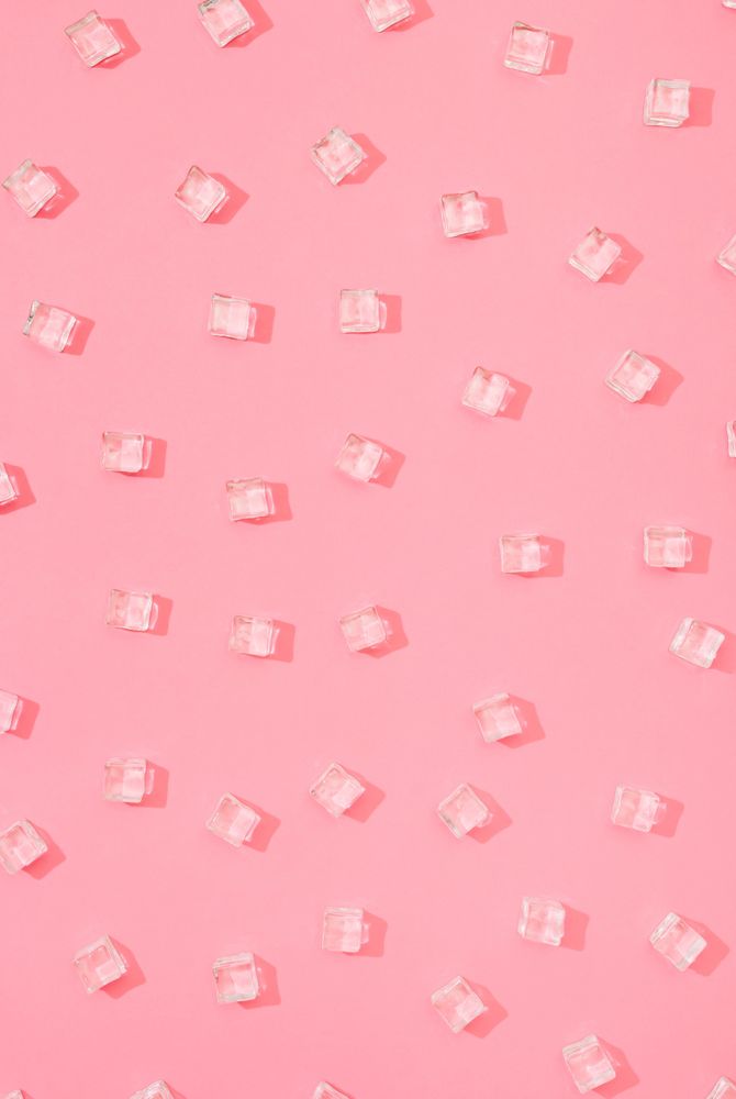 Ice cubes pattern on pastel pink background