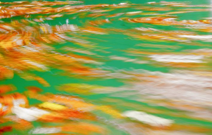 Blurry multicolored water of river flow