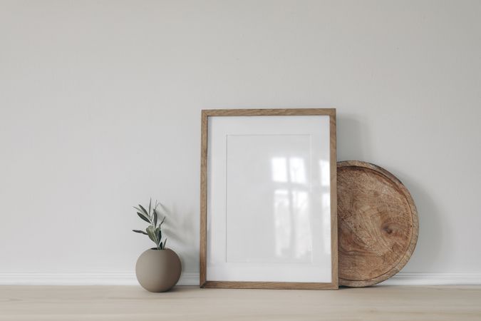 Blank vertical picture frame mockup, poster display.