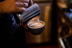 Cappuccino art being poured