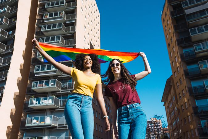 Female couple with LGBTQIA flag