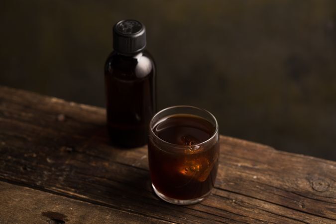 Coffee drink served in a glass on wooden table