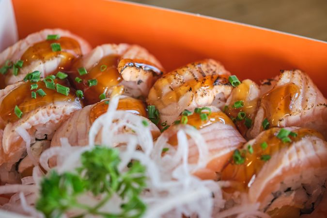 Seared salmon sushi rolls with daikon