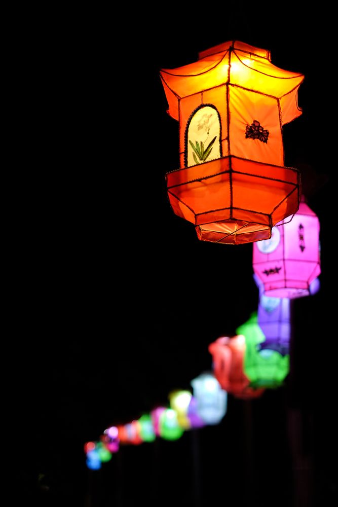 Colorful Japanese lanterns against dark background