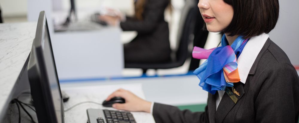 Banner of woman in silk scarf flight attendant uniform working in airport
