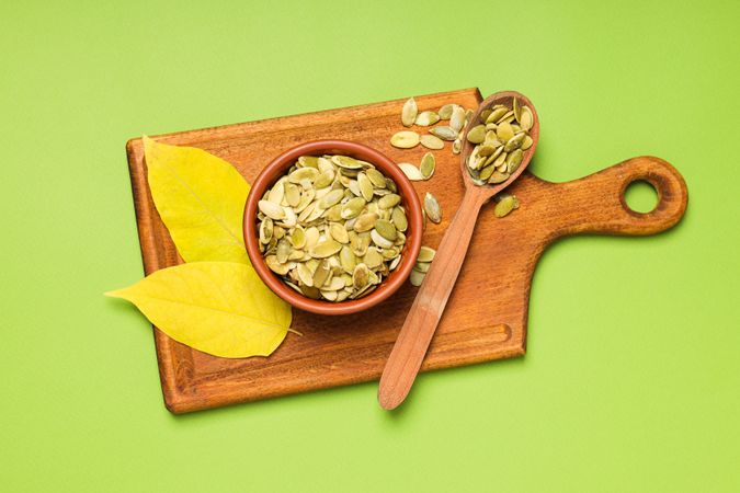 Cooking ingredients for fall season - pumpkin seeds, pumpkin