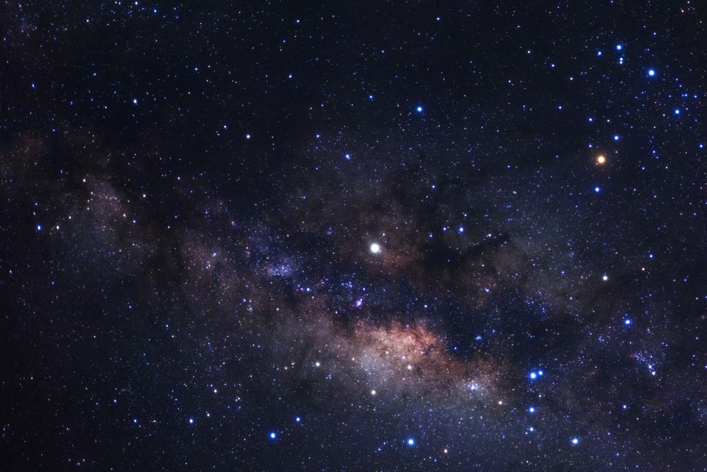 Milky way galaxy with stars and space dust in the universe, Long exposure photograph, with grain.
