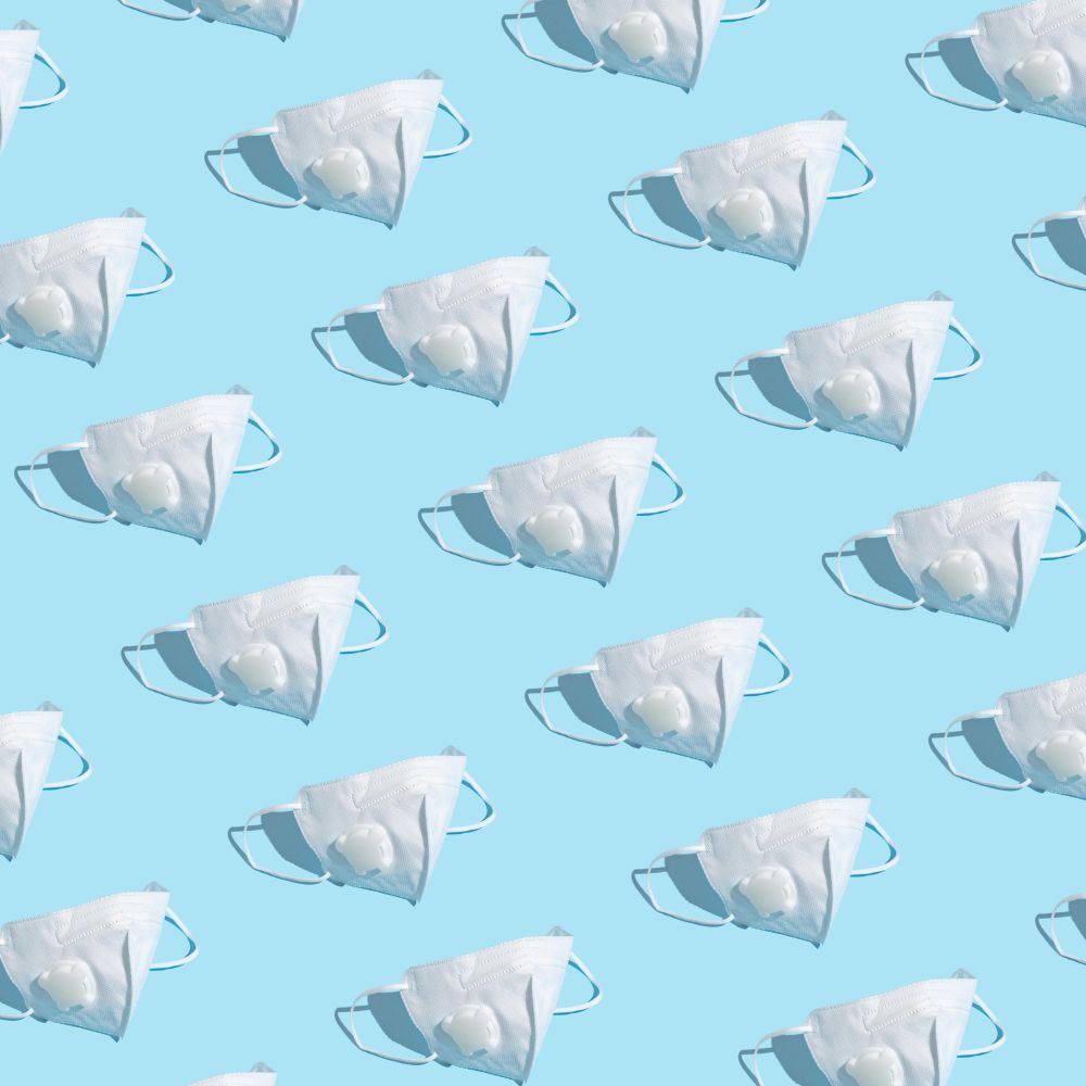 Medical mask pattern on pastel blue background