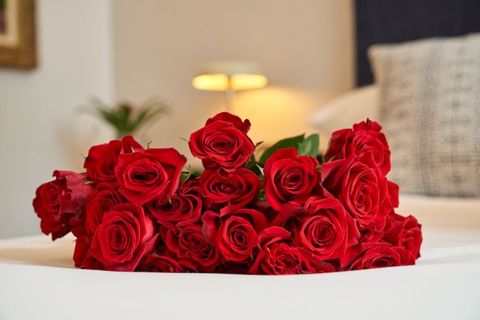 Bouquet of red roses in room