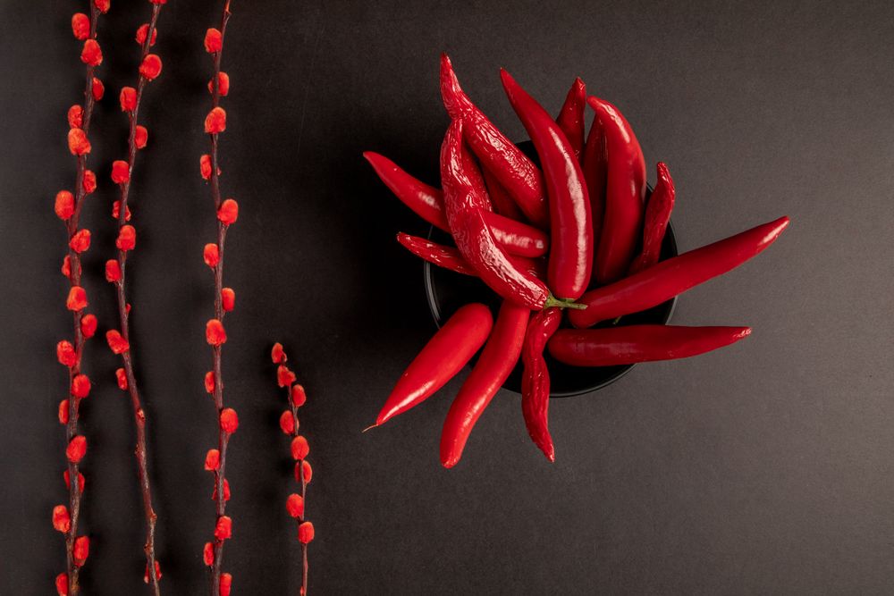 branches near peppers and strawberries