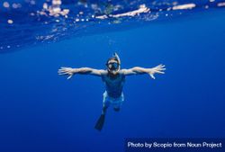 Underwater shot of man diving 4AvKqb