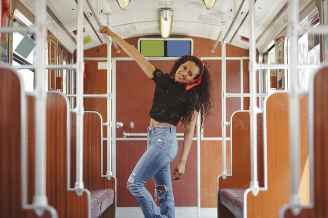 Cheerful woman in train car