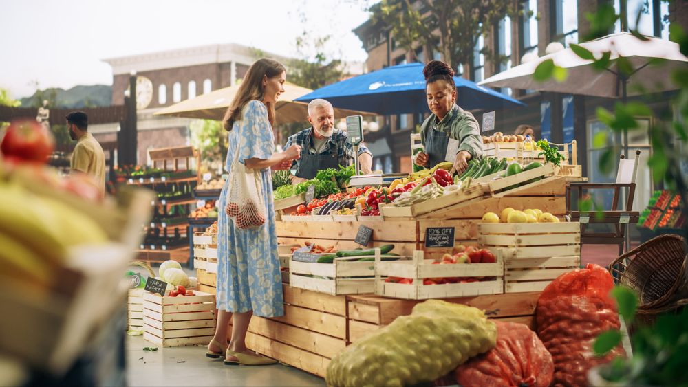 Middle Aged Couple Running a Small Business on a Farmers Market,