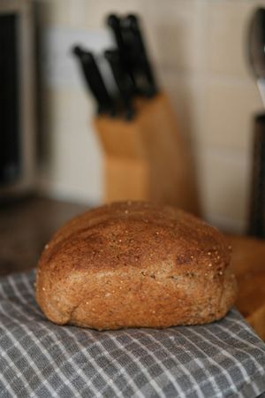Rustic Homemade Sourdough Bread Loaf and Knife Block