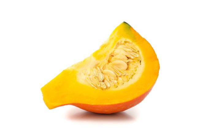 Slice of pumpkin isolated on blank background