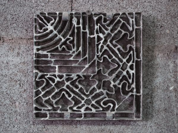 Metal mold with ornament in workshop