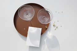 Bubbly wine glasses on round tray with mock up card
