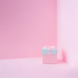 Pink and baby blue jewelry gift box on pastel backdrop