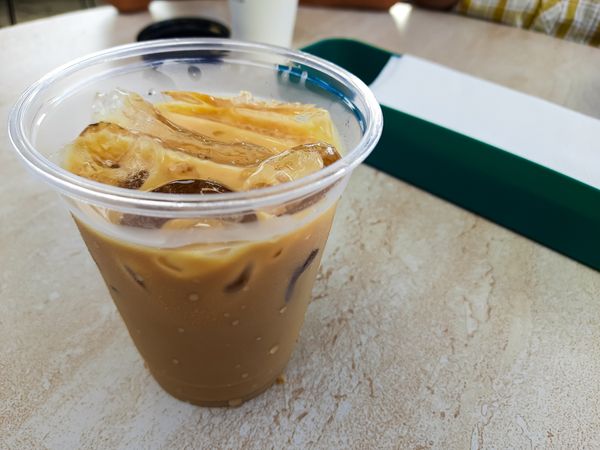 Plastic take-away cup with iced coffee