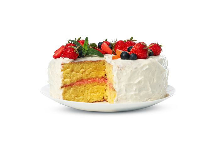 Plate with berry cream cake isolated on plain background