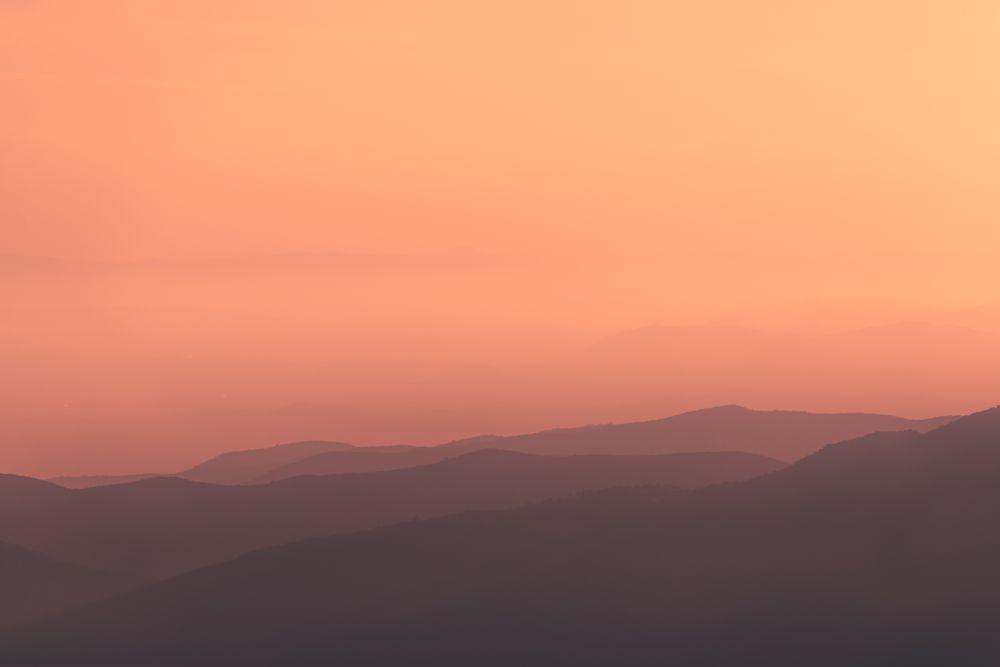Sunset sky over mountain ridge