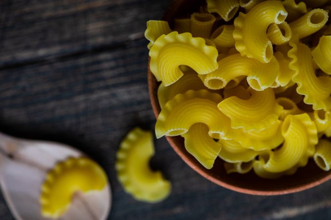 Cooking concept with bowl of dried creste pasta