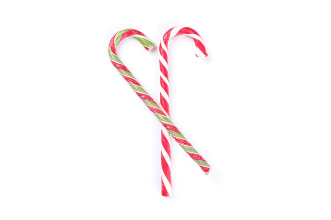 Sweet candy canes isolated on blank background