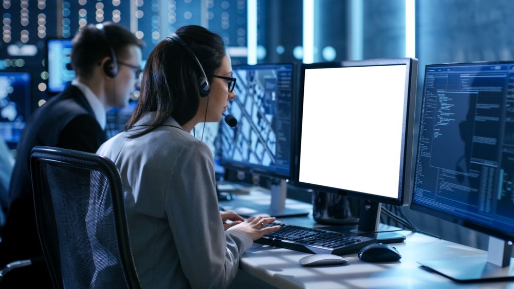 Close up Shot of Female working in a Technical Support Team Gives Instructions with the Help of the Headsets.