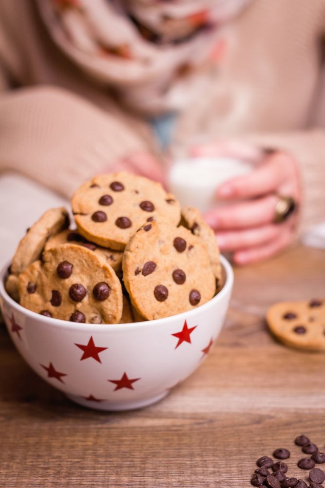 Chocolate chip cookies on stars bowl over a table