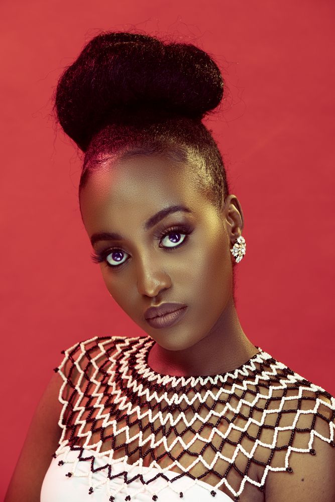 Portrait of African lady against red background