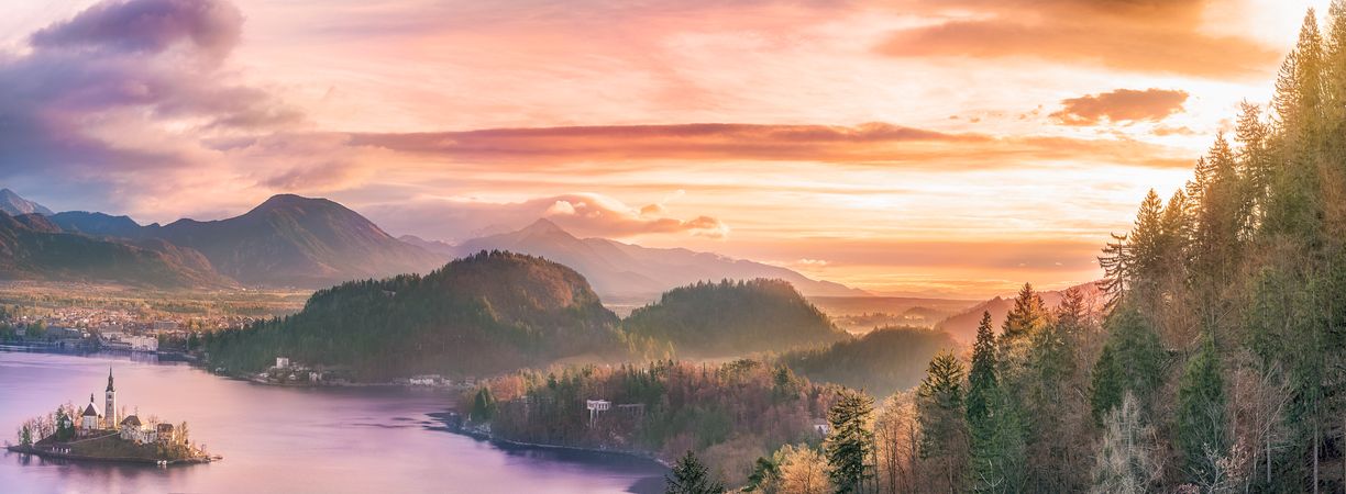 Bled island and surrounding hills at sunrise